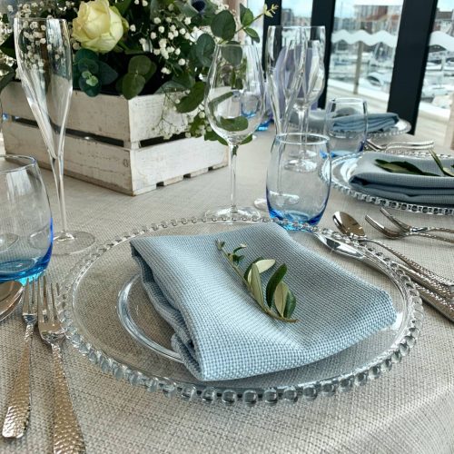 glass beaded charger plate on a wedding table setup
