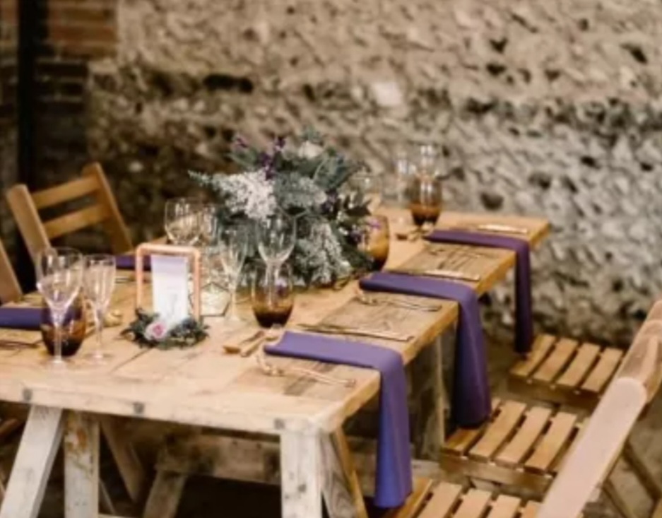 rustic-table-with-purple-colour-scheme-in-keeping-with-summer-wedding-theme
