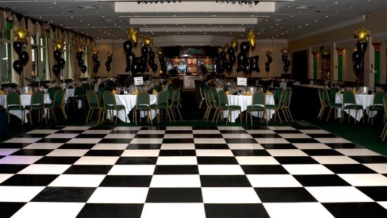 A black and white damce floor at a company party